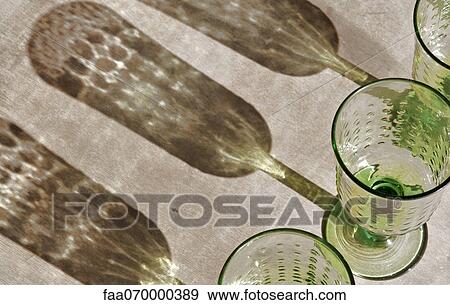 Stock Photo - Stemmed glasses and shadow. Fotosearch
