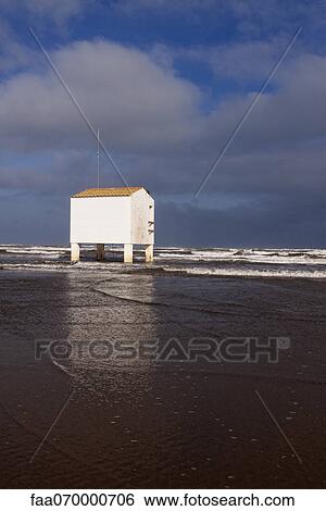 Stilt building on beach during high tide View Large Photo Image Stock Photograph - Stilt building on beach during high tide. Fotosearch