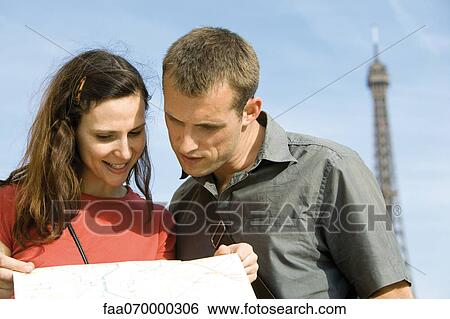 Tourists looking at map View Large Photo Image Stock Photograph - Tourists looking at map. Fotosearch