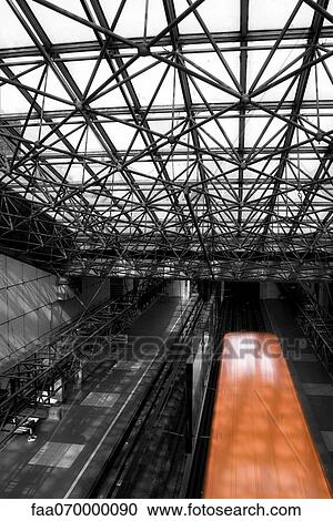 Train station, train moving on track, partial desaturation View Large Photo Image Stock Image - Train station, train moving on track, partial desaturation. Fotosearch