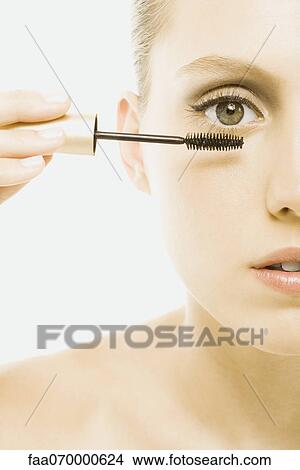 Woman applying mascara View Large Photo Image Picture - Woman applying mascara. Fotosearch