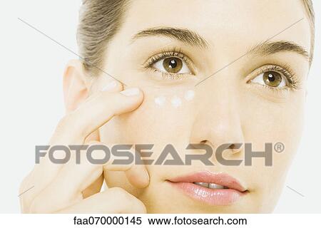 Woman applying undereye cream, close-up View Large Photo Image Stock Photography - Woman applying undereye cream, close-up. Fotosearch