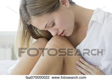 Woman caressing bare legs View Large Photo Image Stock Image - Woman caressing bare legs. Fotosearch