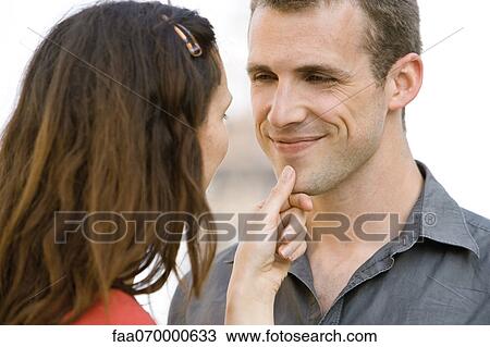 Woman caressing man's chin View Large Photo Image Stock Image - Woman caressing man's chin. Fotosearch