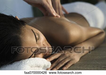 Woman enjoying back massage View Large Photo Image Stock Photograph - Woman enjoying back massage. Fotosearch