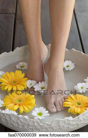 Woman enjoying relaxing foot bath View Large Photo Image Stock Photo - Woman enjoying relaxing foot bath. Fotosearch