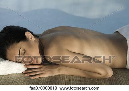 Woman lying in shade with eyes closed View Large Photo Image Stock Photo - Woman lying in shade with eyes closed. Fotosearch