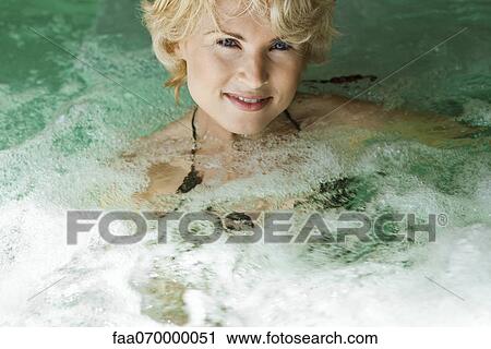 Woman relaxing in spa jacuzzi View Large Photo Image Stock Image - Woman relaxing in spa jacuzzi. Fotosearch