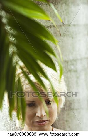 Woman relaxing under palm tree View Large Photo Image Stock Image - Woman relaxing under palm tree. Fotosearch