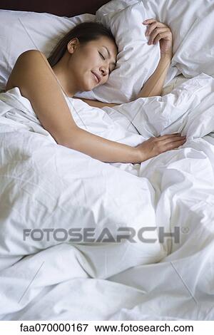 Stock Photo - Woman sleeping. Fotosearch