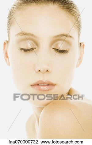 Woman with eyes closed, wearing natural cosmetics, resting chin on shoulder View Large Photo Image Stock Image - Woman with eyes closed, wearing natural cosmetics, resting chin on shoulder. Fotosearch