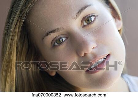 Woman with head tilted, portrait View Large Photo Image Stock Image - Woman with head tilted, portrait. Fotosearch