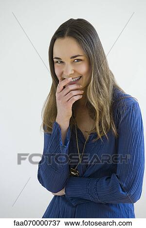 Young woman laughing, portrait View Large Photo Image Stock Photo - Young woman laughing, portrait. Fotosearch
