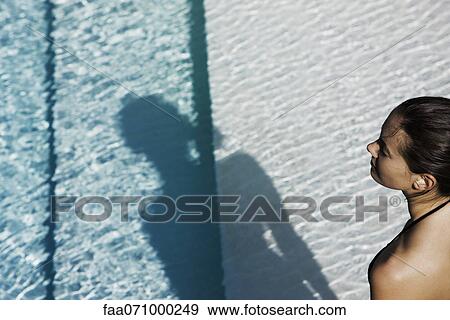 At swimming pool on hot summer day View Large Photo Image Stock Photo - At swimming pool on hot summer day. Fotosearch