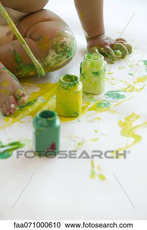 Baby playing with paint, cropped View Large Photo Image Stock Image - Baby playing with paint, cropped. Fotosearch