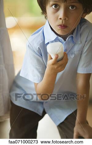 Boy aiming wireless video game controller View Large Photo Image Stock Image - Boy aiming wireless video game controller. Fotosearch