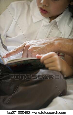 Boy learning to read, cropped View Large Photo Image Stock Image - Boy learning to read, cropped. Fotosearch