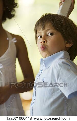 Boy playing video game with wireless controller View Large Photo Image Stock Photo - Boy playing video game with wireless controller. Fotosearch