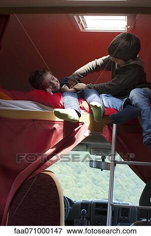 Boy tickling brother View Large Photo Image Stock Photo - Boy tickling brother. Fotosearch