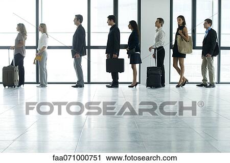 Stock Image - Business people standing in line. Fotosearch