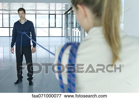 Businessman bound in rope View Large Photo Image Stock Photo - Businessman bound in rope. Fotosearch