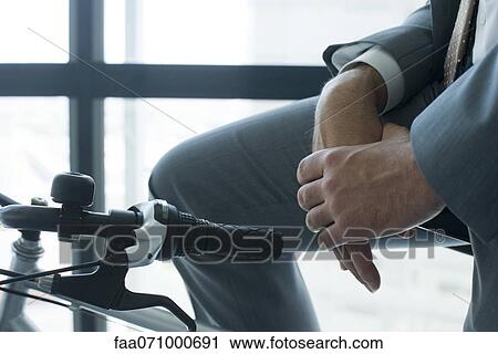 Businessman sitting on bicycle View Large Photo Image Stock Image - Businessman sitting on bicycle. Fotosearch
