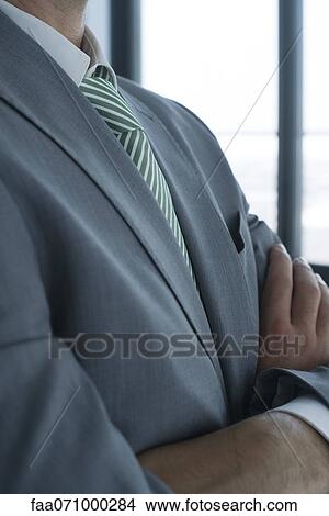 Businessman with arms folded, mid section View Large Photo Image Picture - Businessman with arms folded, mid section. Fotosearch