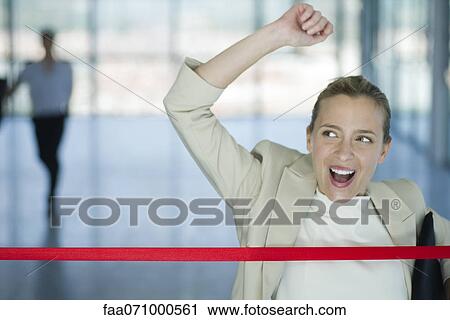 Businesswoman crossing finishing line View Large Photo Image Stock Image - Businesswoman crossing finishing line. Fotosearch