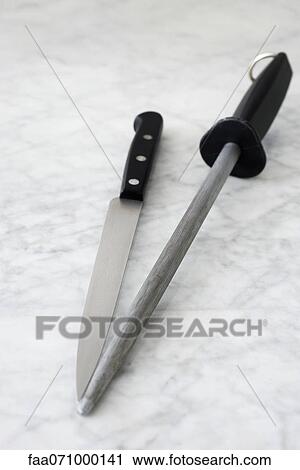Carving knife and knife sharpener View Large Photo Image Stock Image - Carving knife and knife sharpener. Fotosearch