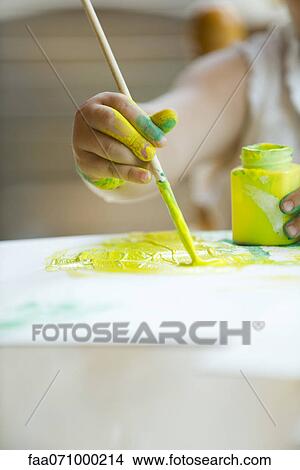 Child painting with paintbrush, cropped View Large Photo Image Picture - Child painting with paintbrush, cropped. Fotosearch