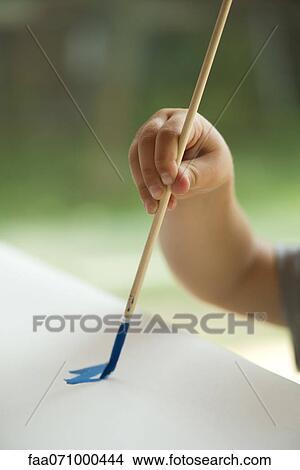Child painting with paintbrush, cropped View Large Photo Image Picture - Child painting with paintbrush, cropped. Fotosearch