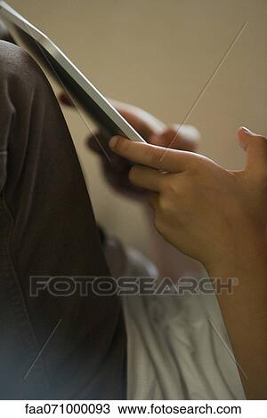 Child using digital tablet, cropped View Large Photo Image Stock Image - Child using digital tablet, cropped. Fotosearch
