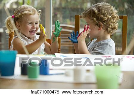 Children finger painting, hands covered in paint View Large Photo Image Stock Photography - Children finger painting, hands covered in paint. Fotosearch