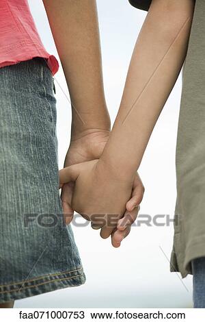 Children holding hands, close-up View Large Photo Image Stock Image - Children holding hands, close-up. Fotosearch
