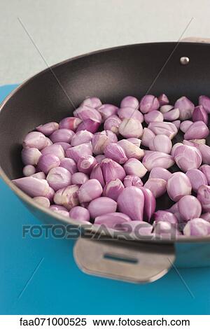 Cooking shallots in pan View Large Photo Image Stock Photography - Cooking shallots in pan. Fotosearch