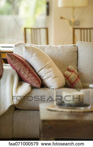 Cushions on sofa in living room View Large Photo Image Stock Photo - Cushions on sofa in living room. Fotosearch