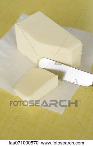 Cutting butter View Large Photo Image Stock Image - Cutting butter. Fotosearch