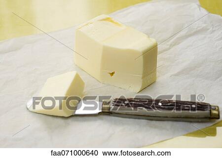 Cutting butter View Large Photo Image Stock Image - Cutting butter. Fotosearch