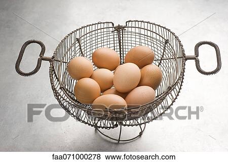 Eggs in basket View Large Photo Image Stock Photo - Eggs in basket. Fotosearch