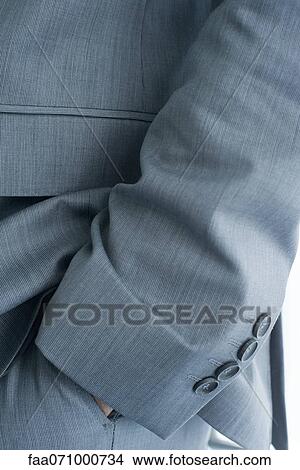 Executive with hand in pocket, cropped View Large Photo Image Picture - Executive with hand in pocket, cropped. Fotosearch