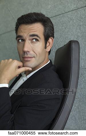 Executive with hand under chin, portrait View Large Photo Image Stock Photography - Executive with hand under chin, portrait. Fotosearch