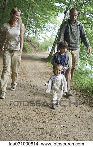 Picture - Family hiking in woods. Fotosearch