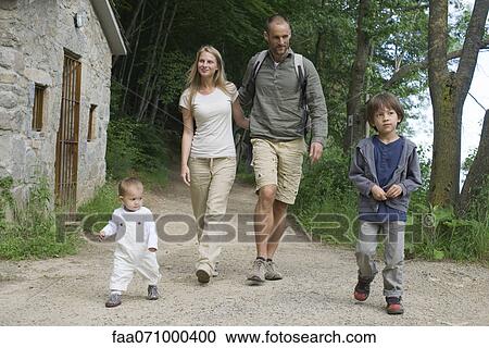 Family hiking in woods View Large Photo Image Stock Image - Family hiking in woods. Fotosearch