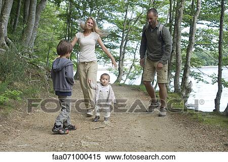 Family hiking in woods View Large Photo Image Stock Photography - Family hiking in woods. Fotosearch