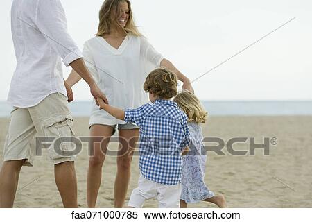 Family playing ring-around-the-rosy at the beach View Large Photo Image Stock Photography - Family playing ring-around-the-rosy at the beach. Fotosearch