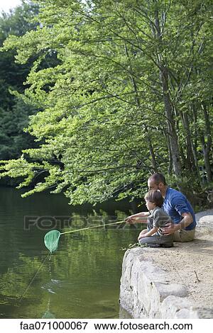 Father teaching son how to fish View Large Photo Image Stock Photo - Father teaching son how to fish. Fotosearch