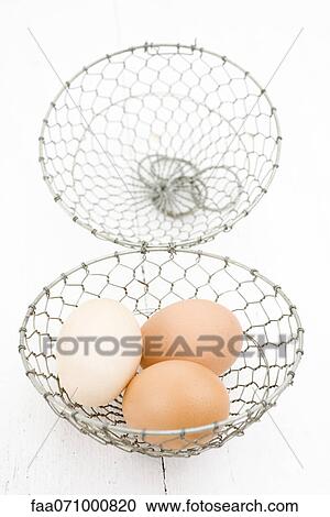 Fresh eggs in wire basket View Large Photo Image Stock Image - Fresh eggs in wire basket. Fotosearch