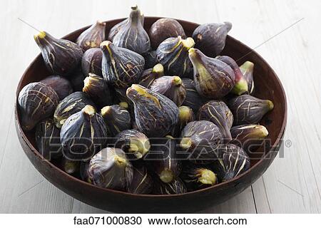 Stock Image - Fresh figs in bowl. Fotosearch