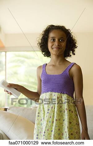 Girl playing video game using wireless controller View Large Photo Image Stock Photo - Girl playing video game using wireless controller. Fotosearch