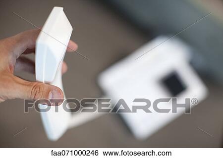 Hand holding landline phone receiver View Large Photo Image Stock Photograph - Hand holding landline phone receiver. Fotosearch